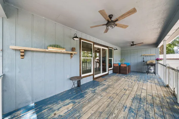 a view of a balcony with wooden floor