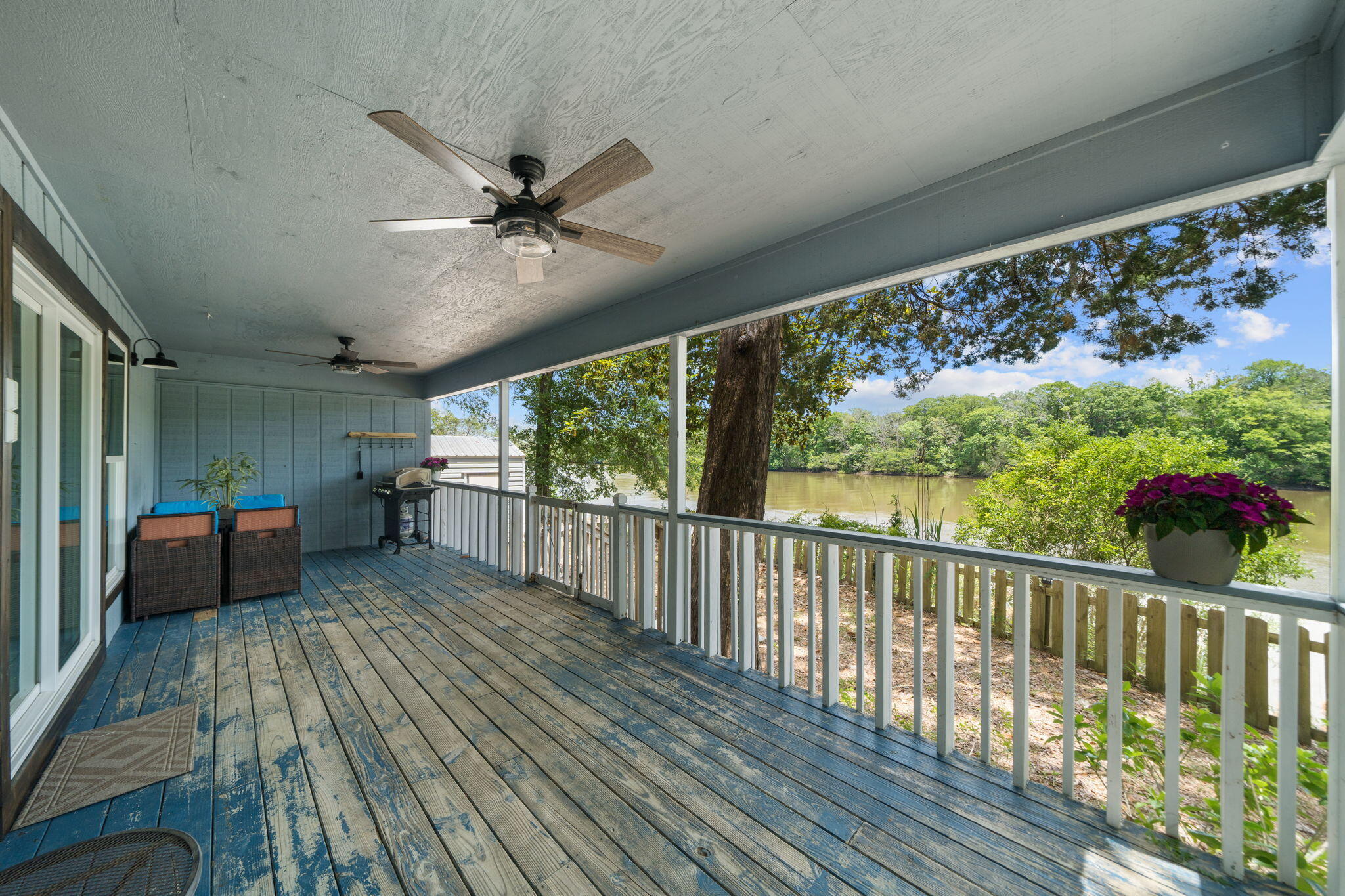 439 Big Cedar Road Ponce de Leon, FL 32455 - Photo 39 of 48 a view of a porch with furniture and a yard