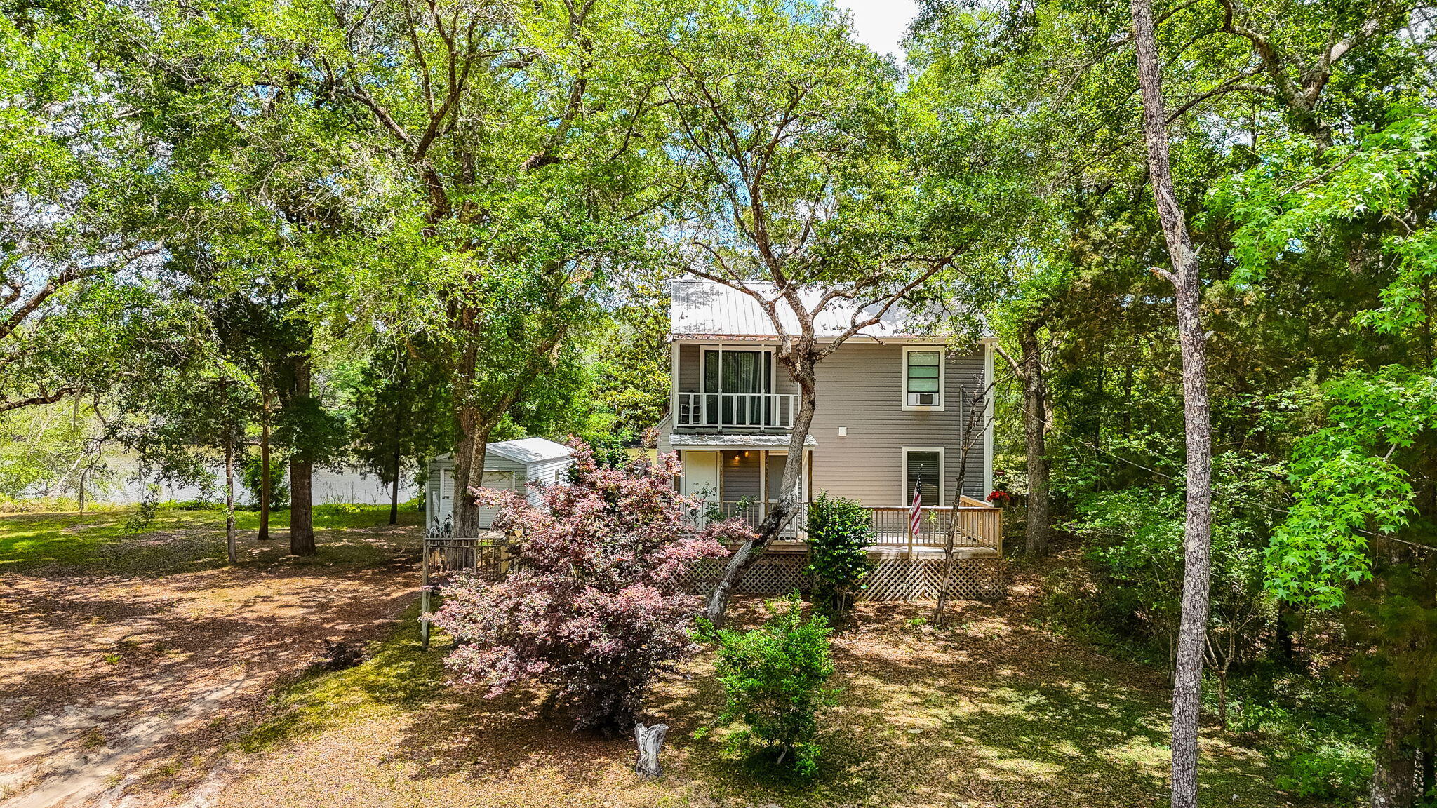 439 Big Cedar Road Ponce de Leon, FL 32455 - Photo 4 of 48 a backyard of a house with lots of green space