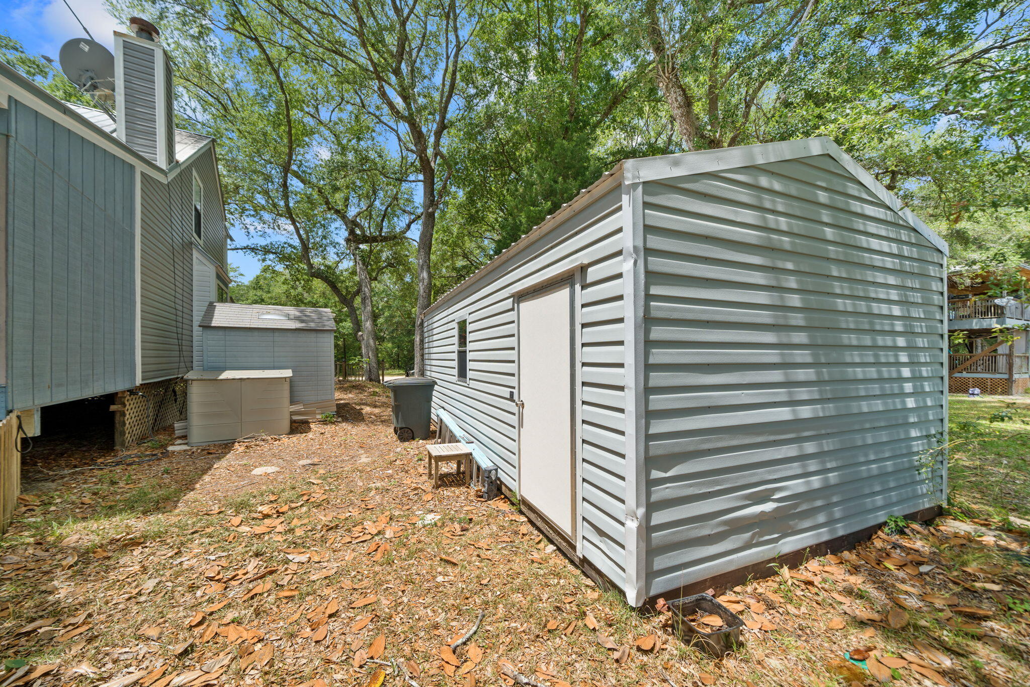 439 Big Cedar Road Ponce de Leon, FL 32455 - Photo 42 of 48 a view of a house with a yard and large tree