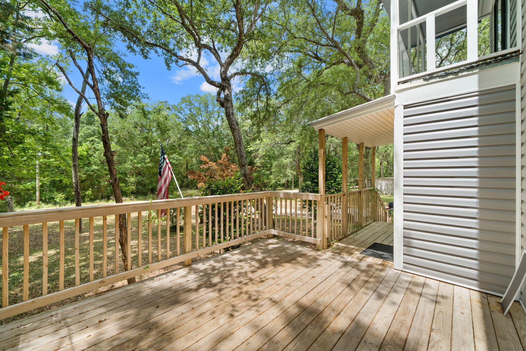 439 Big Cedar Road Ponce de Leon, FL 32455 - Photo 44 of 48 a view of a wooden deck