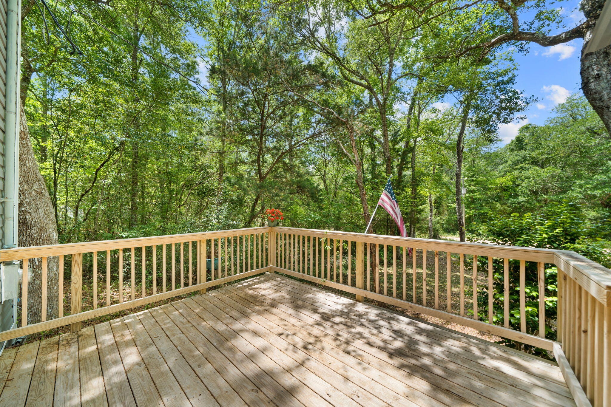 439 Big Cedar Road Ponce de Leon, FL 32455 - Photo 45 of 48 a view of a wooden roof deck