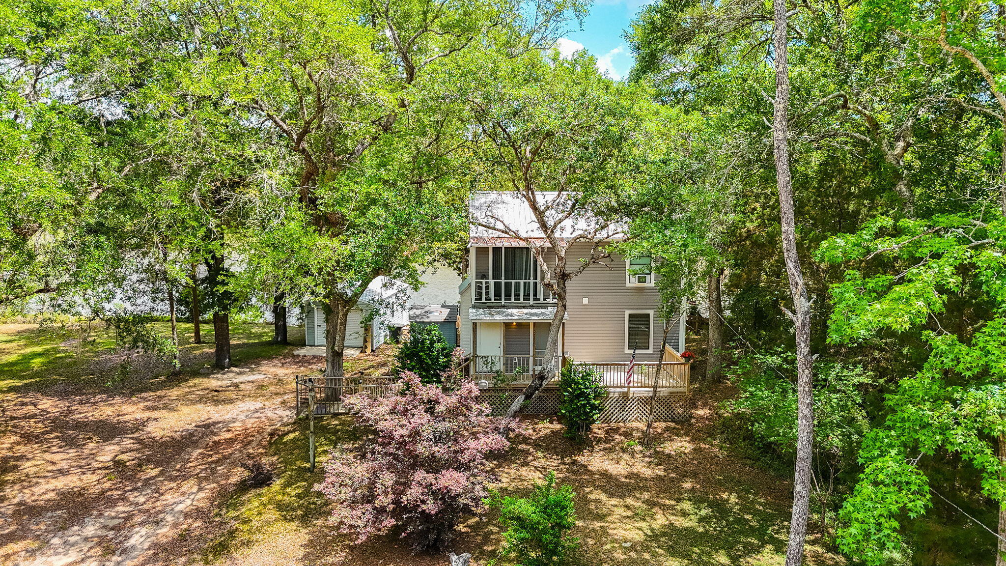 439 Big Cedar Road Ponce de Leon, FL 32455 - Photo 5 of 48 a front view of a house with a garden