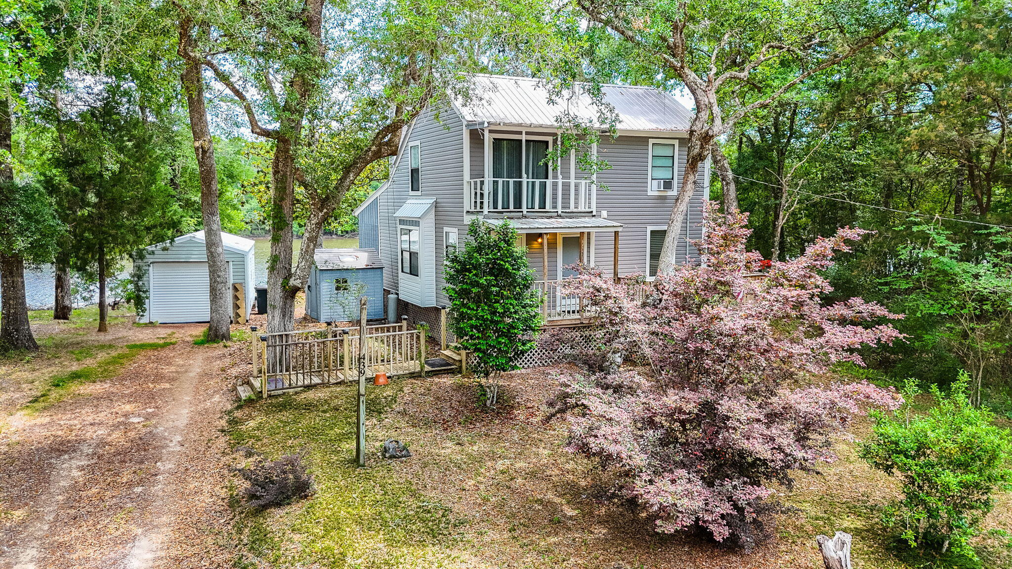 439 Big Cedar Road Ponce de Leon, FL 32455 - Photo 7 of 48 a view of a house with a yard and large trees