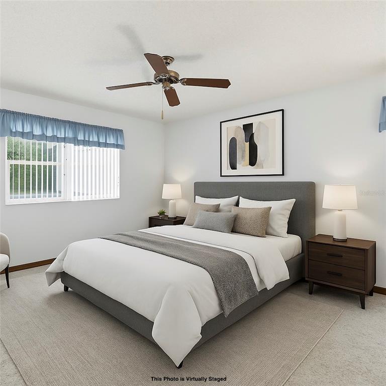 2414 Appian Avenue Spring Hill, FL 34608 - Photo 14 of 37 a bedroom with a bed and window