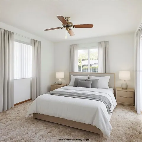 a bedroom with a bed and window