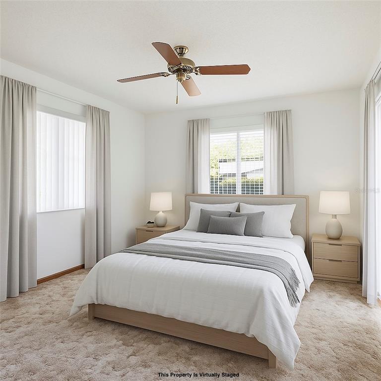 2414 Appian Avenue Spring Hill, FL 34608 - Photo 19 of 37 a bedroom with a bed and window