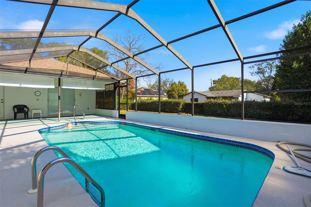 2414 Appian Avenue Spring Hill, FL 34608 - Photo 25 of 37 a view of a backyard with a swimming pool