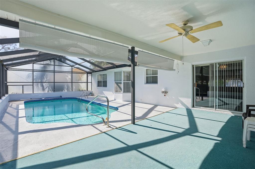 2414 Appian Avenue Spring Hill, FL 34608 - Photo 27 of 37 a view of a livingroom with a ceiling fan and window