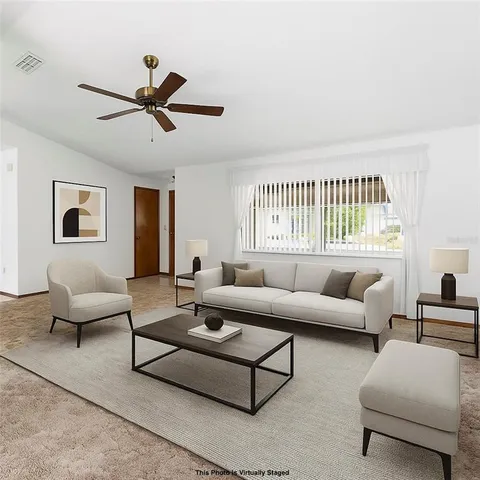 a living room with furniture and a window