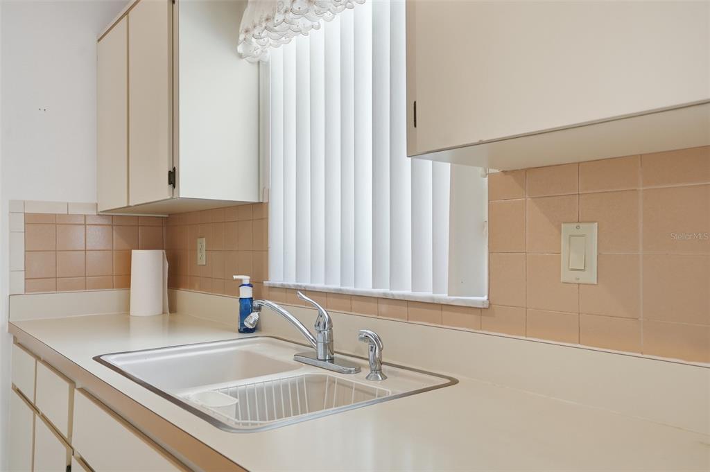 2414 Appian Avenue Spring Hill, FL 34608 - Photo 9 of 37 a bathroom with a sink and a mirror