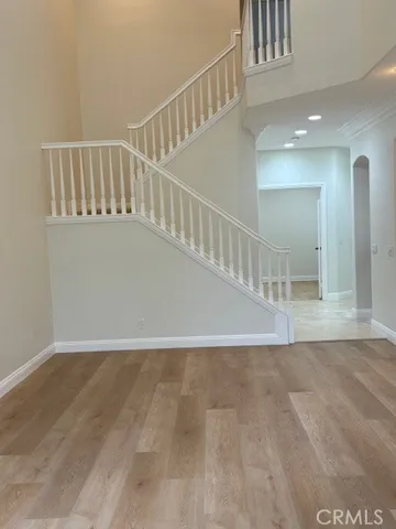 a view of an entryway with wooden floor