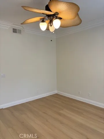 a large bathroom with a large mirror vanity and shower