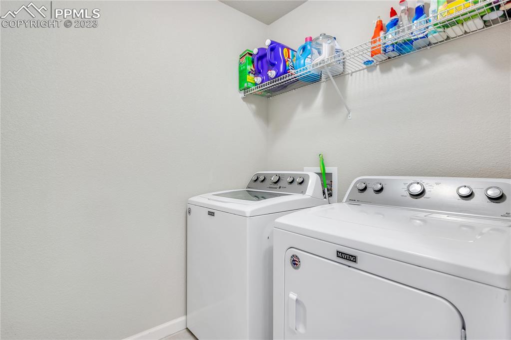 2118 Birmingham Loop Colorado Springs, CO 80910 - Photo 22 of 28 a utility room with dryer and washer
