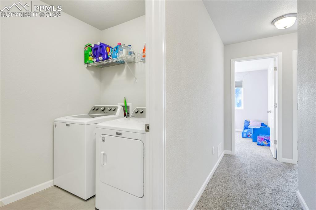 2118 Birmingham Loop Colorado Springs, CO 80910 - Photo 23 of 28 a utility room with dryer and washer