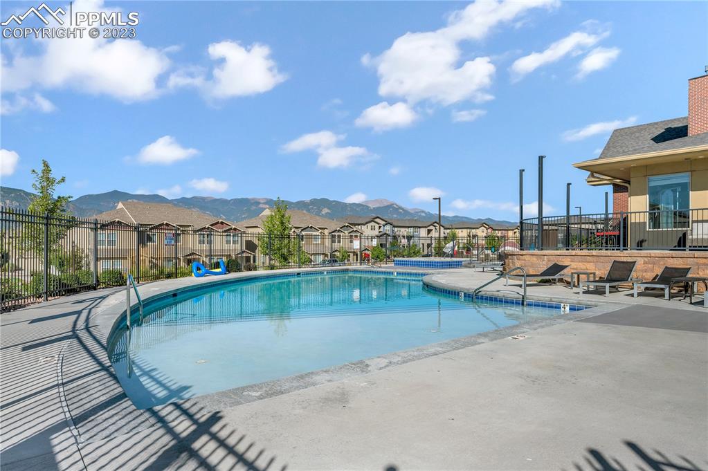 2118 Birmingham Loop Colorado Springs, CO 80910 - Photo 27 of 28 a view of a swimming pool and lounge chair