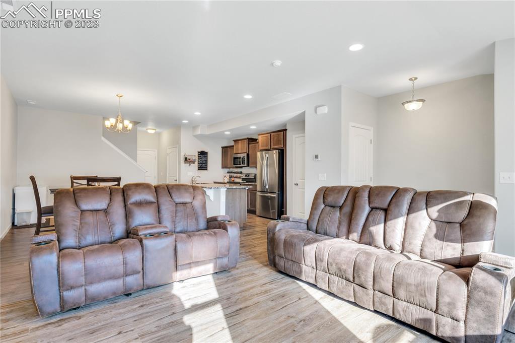 2118 Birmingham Loop Colorado Springs, CO 80910 - Photo 6 of 28 a living room with furniture and kitchen view