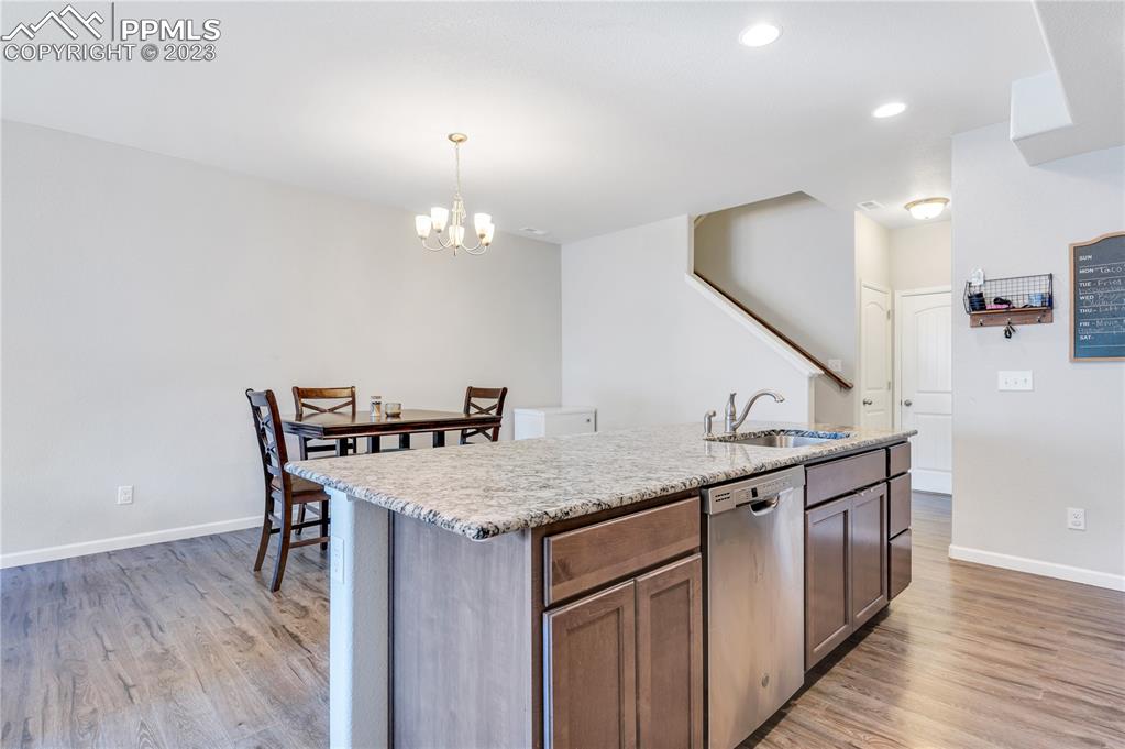 2118 Birmingham Loop Colorado Springs, CO 80910 - Photo 10 of 28 a kitchen that has a table and chairs in it