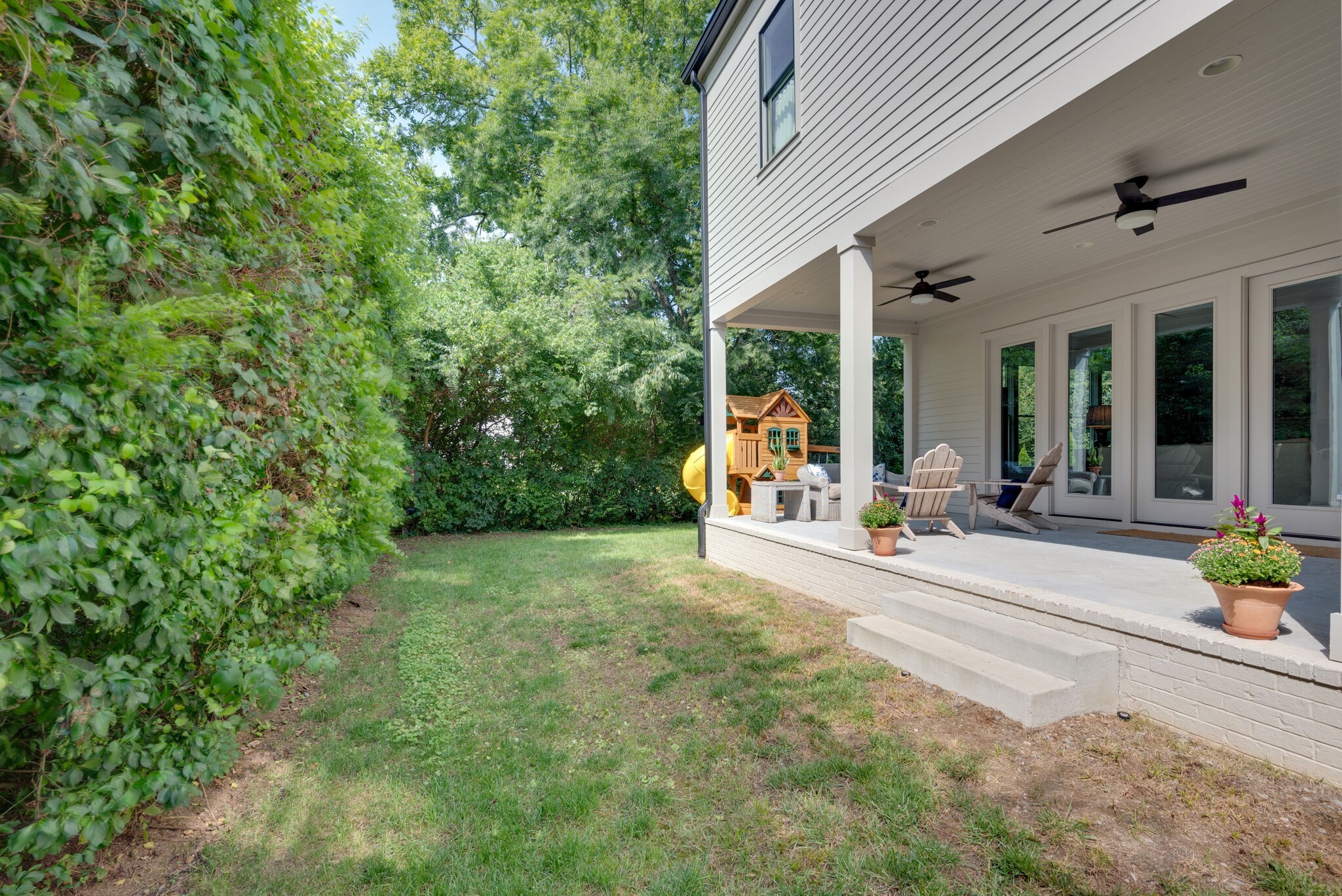 3503 Robin Road Nashville, TN 37204 - Photo 56 of 56 a view of a patio with table and chairs and potted plants