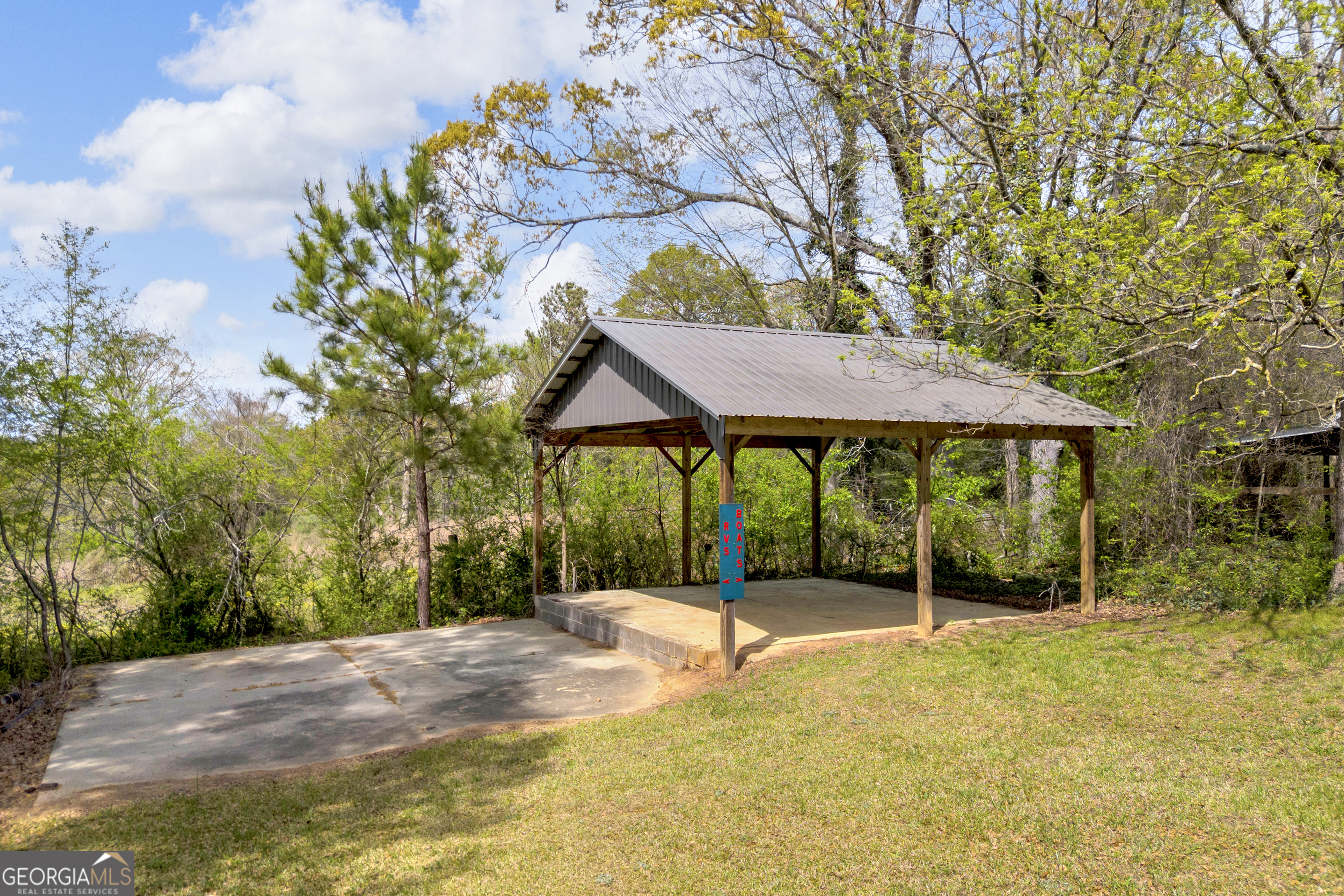 450 Clarks Creek Road North Martin, GA 30557 - Photo 14 of 70 a backyard of a house with table and chairs