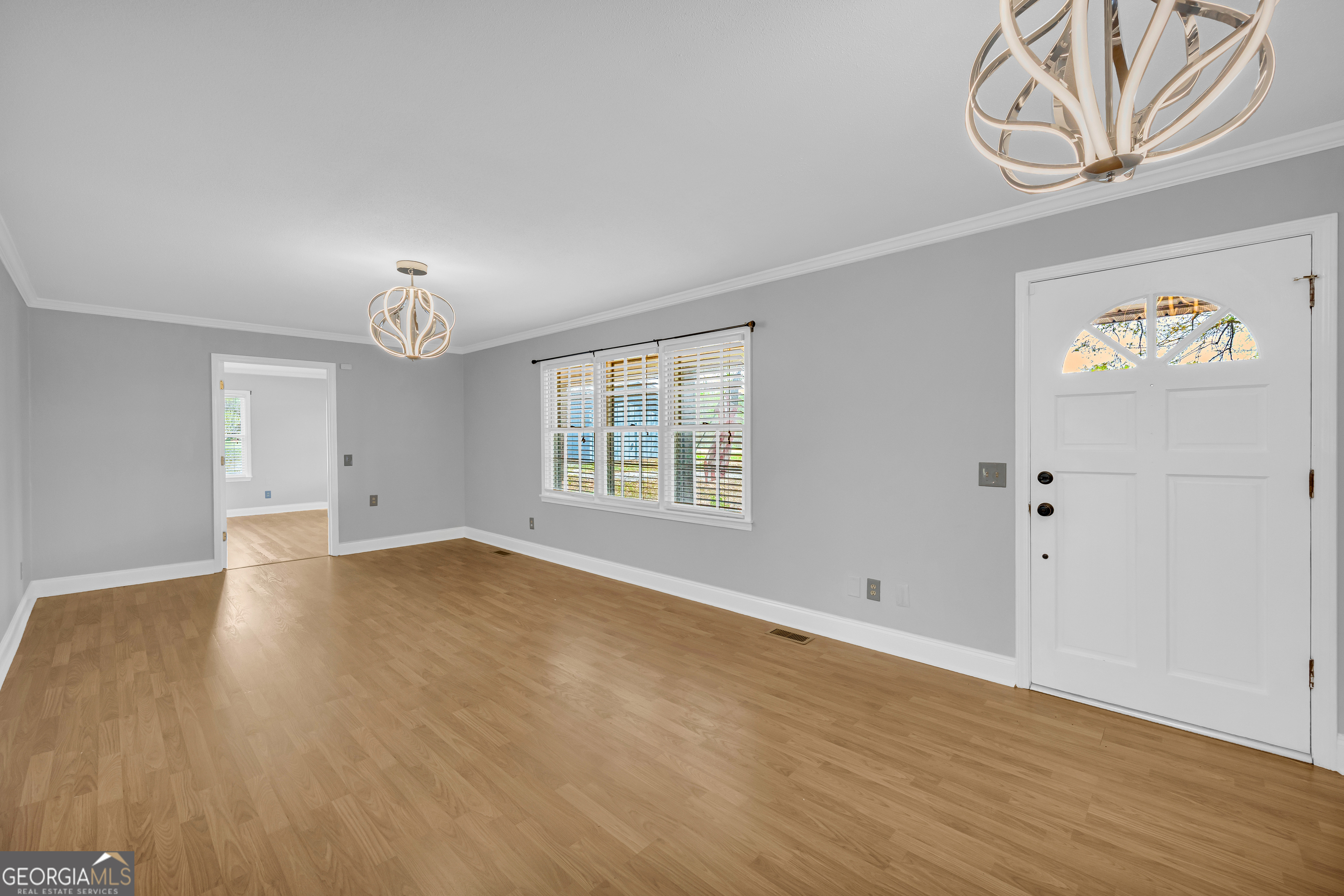 450 Clarks Creek Road North Martin, GA 30557 - Photo 23 of 70 an empty room with wooden floor and windows