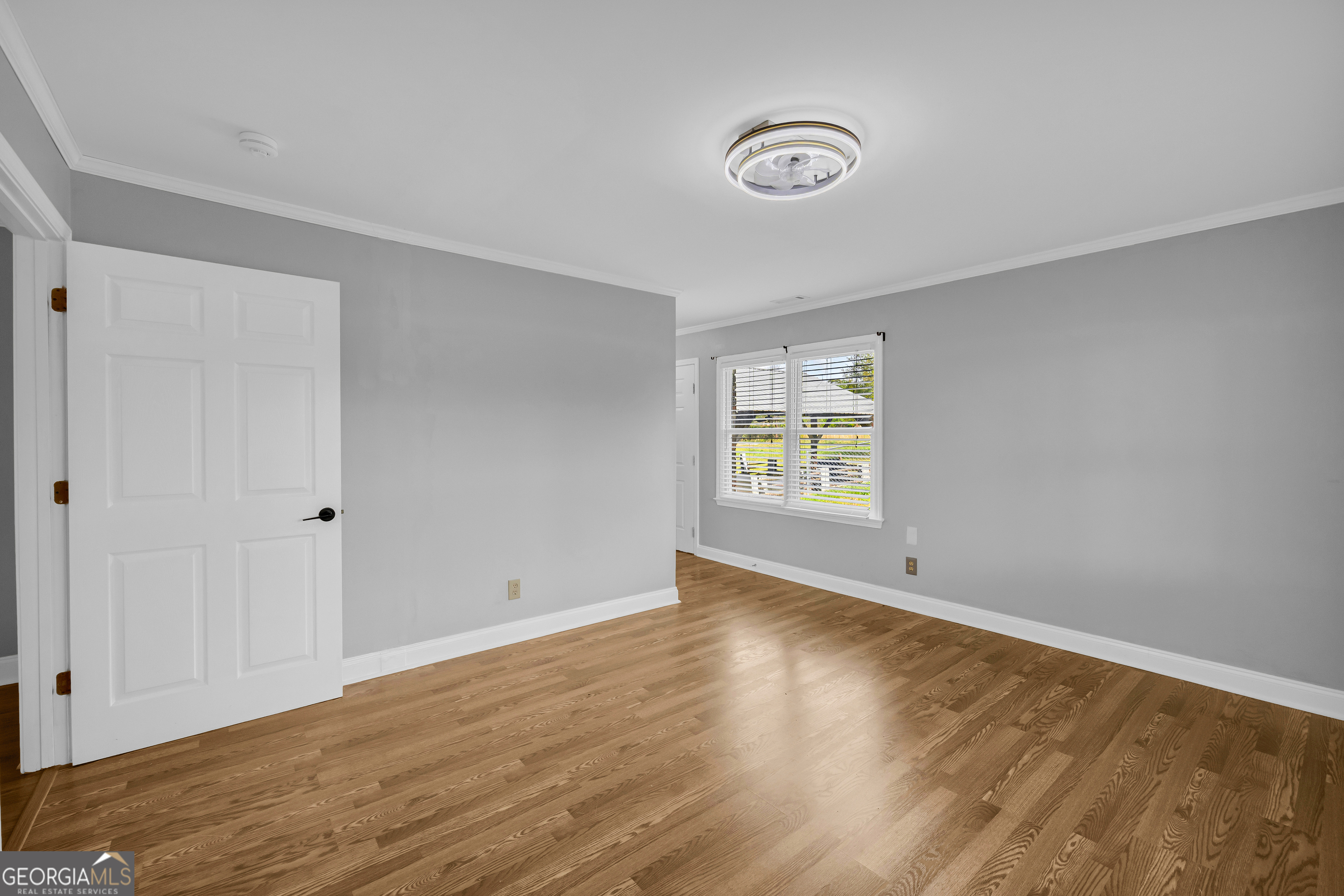 450 Clarks Creek Road North Martin, GA 30557 - Photo 27 of 70 a view of an empty room with wooden floor and a window