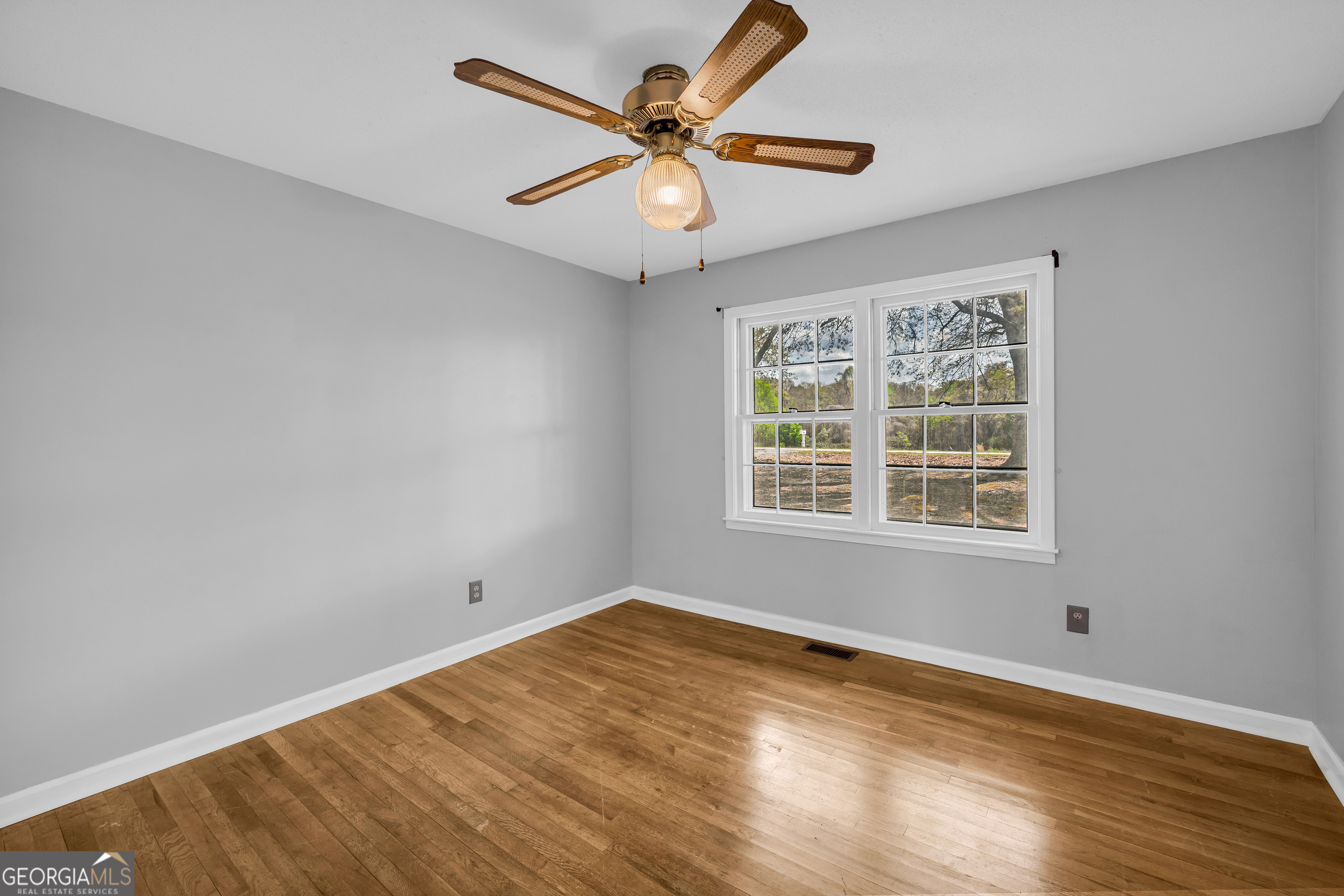 450 Clarks Creek Road North Martin, GA 30557 - Photo 35 of 70 wooden floor in an empty room with a window