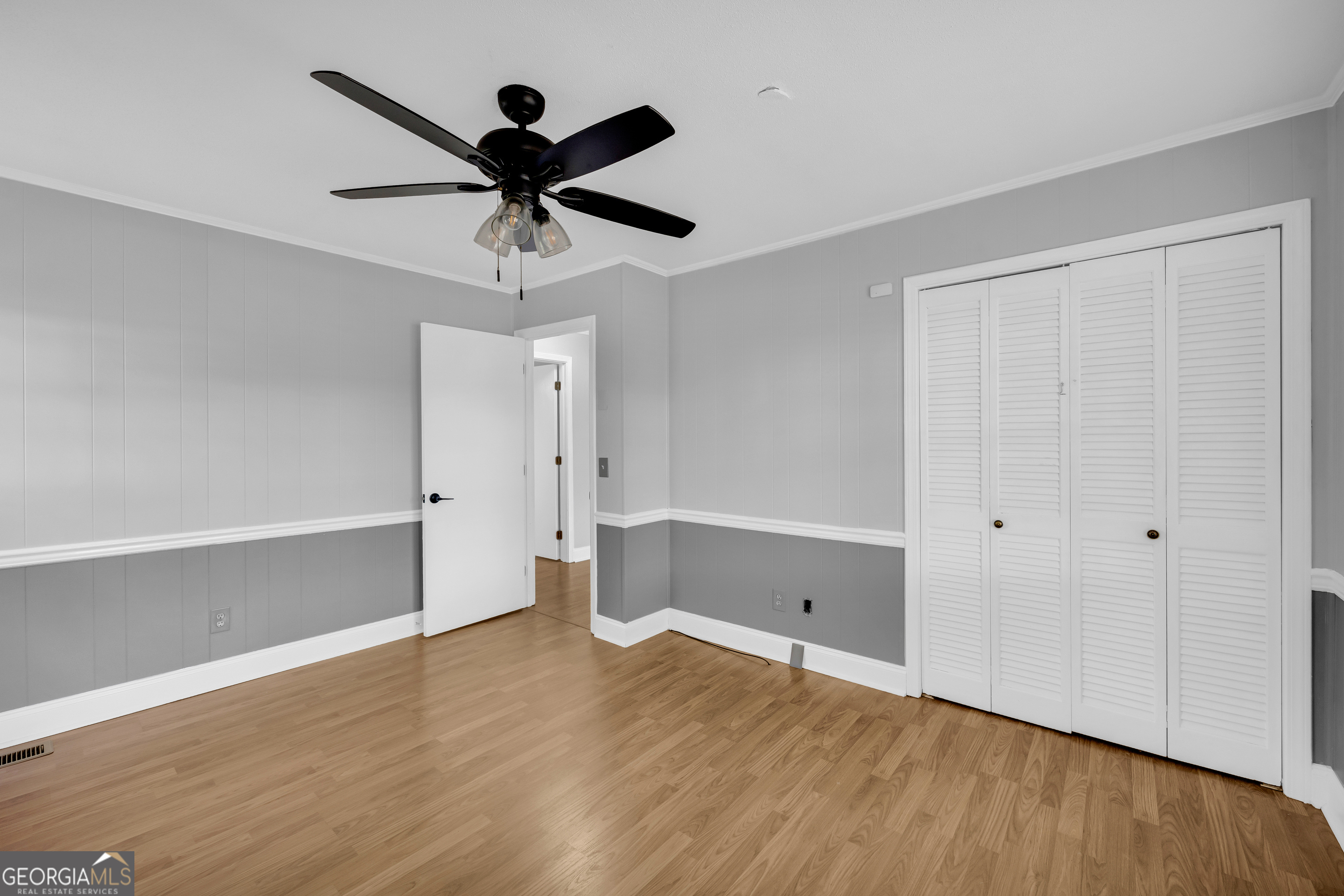 450 Clarks Creek Road North Martin, GA 30557 - Photo 38 of 70 a view of empty room with wooden floor and ceiling fan