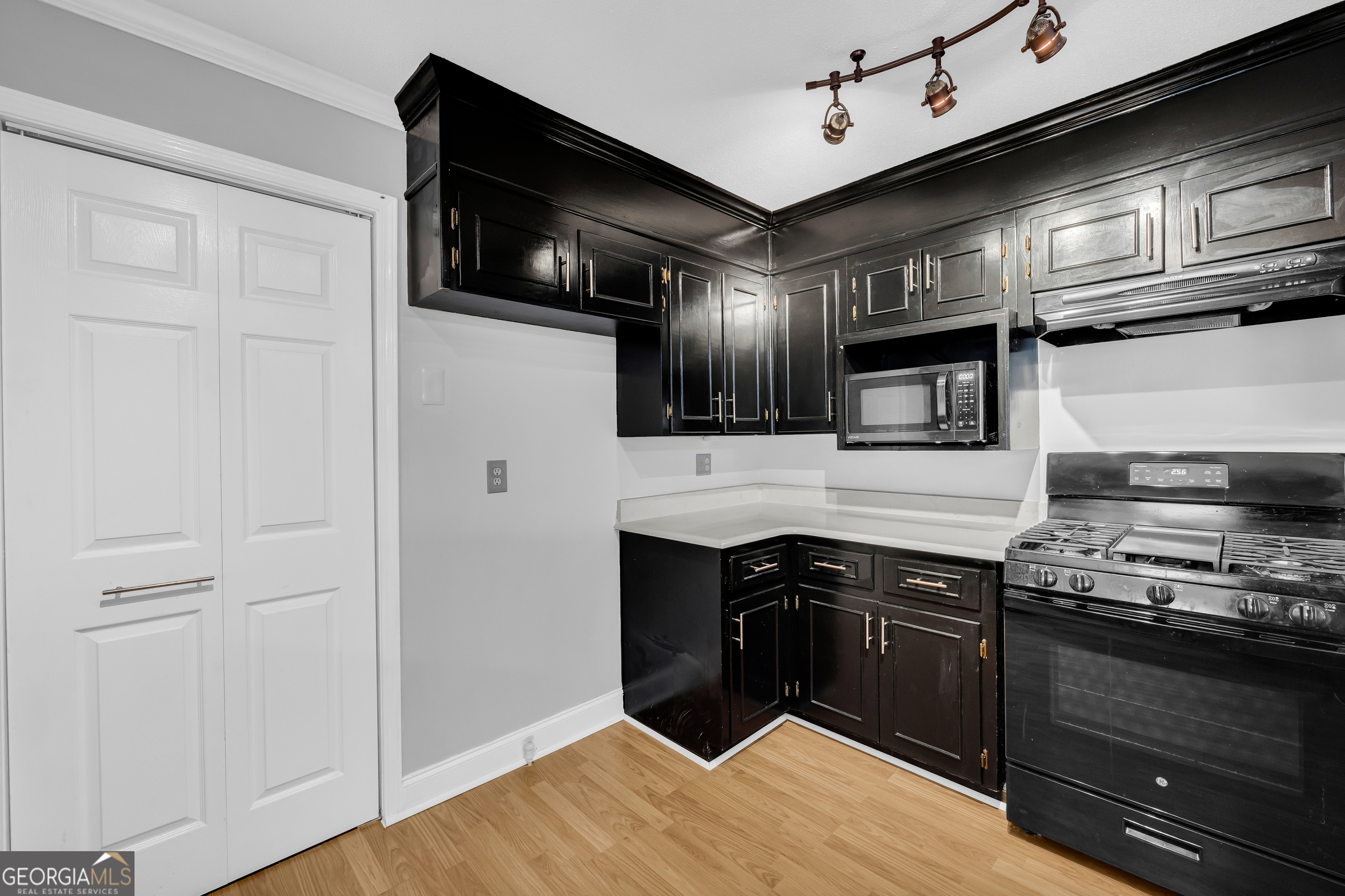 450 Clarks Creek Road North Martin, GA 30557 - Photo 48 of 70 a kitchen with stainless steel appliances granite countertop a stove and a refrigerator