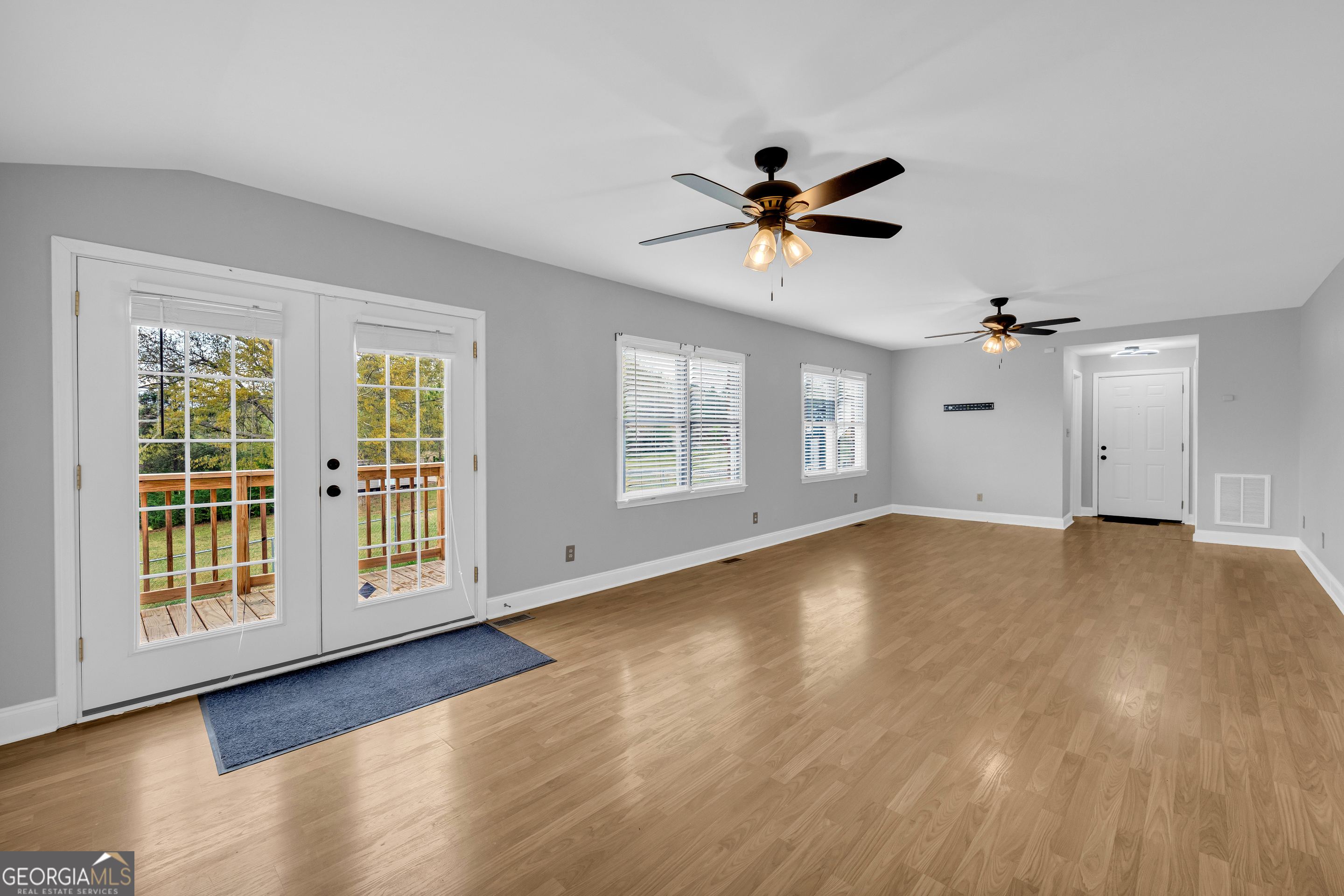 450 Clarks Creek Road North Martin, GA 30557 - Photo 49 of 70 a view of empty room with wooden floor and fan