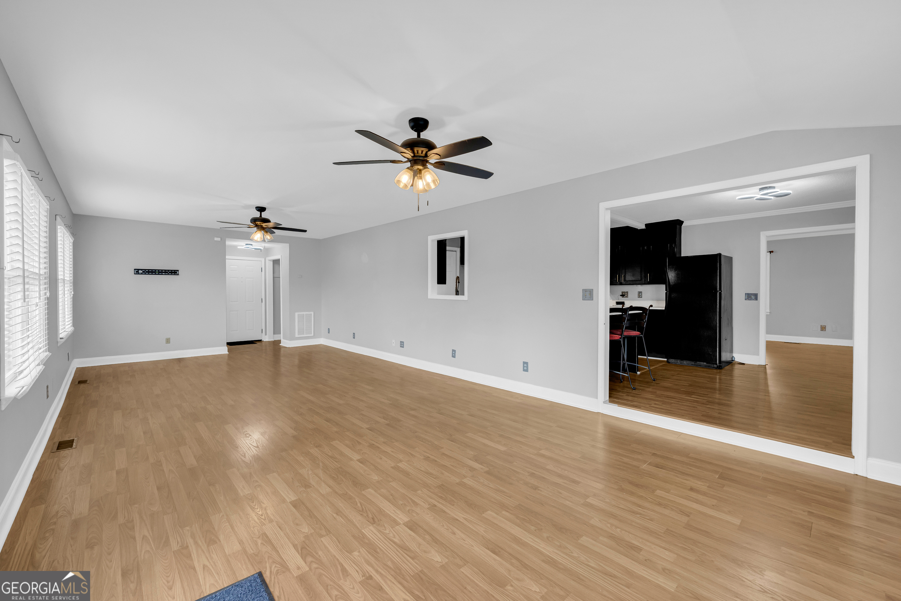 450 Clarks Creek Road North Martin, GA 30557 - Photo 50 of 70 wooden floor in an empty room with a window