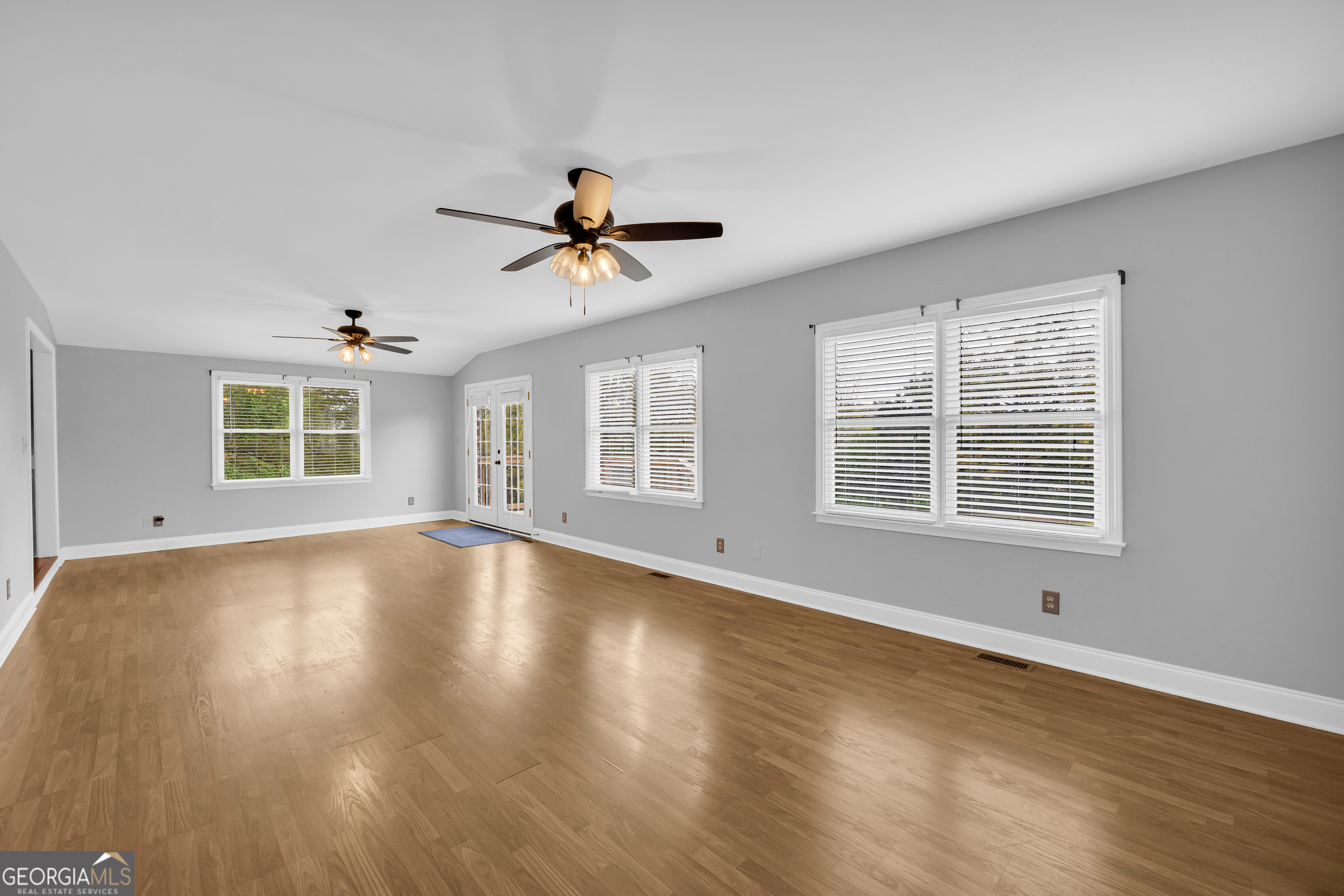 450 Clarks Creek Road North Martin, GA 30557 - Photo 52 of 70 a view of an empty room with wooden floor and a window