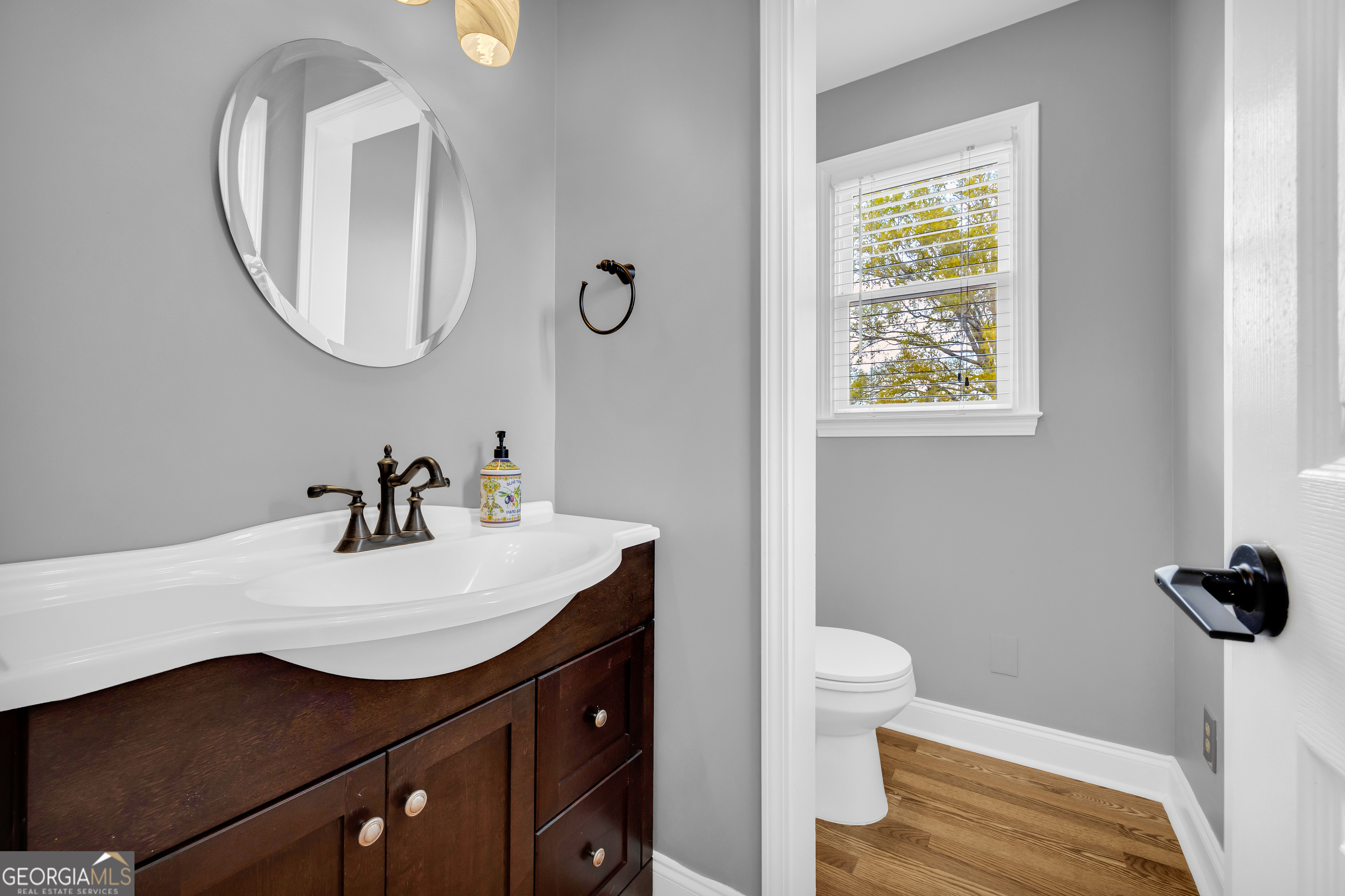 450 Clarks Creek Road North Martin, GA 30557 - Photo 53 of 70 a bathroom with a sink a toilet and a mirror