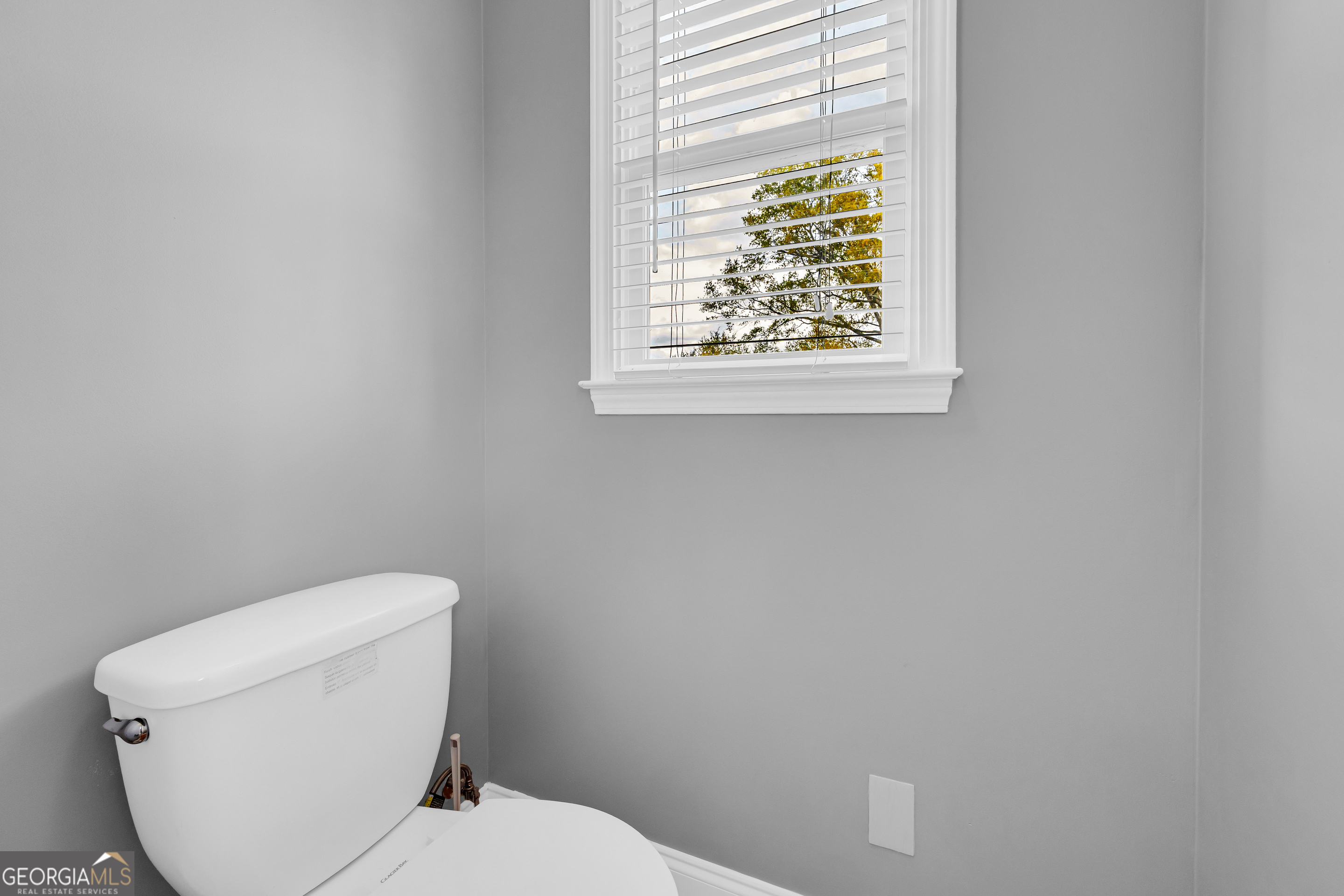 450 Clarks Creek Road North Martin, GA 30557 - Photo 54 of 70 a white toilet sitting next to a window