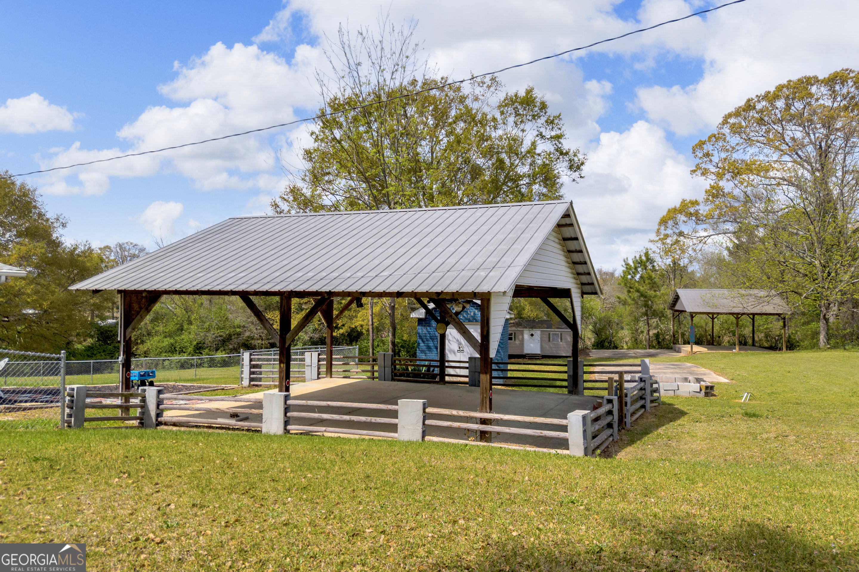 450 Clarks Creek Road North Martin, GA 30557 - Photo 10 of 70 a view of swimming pool with table and chairs under an umbrella