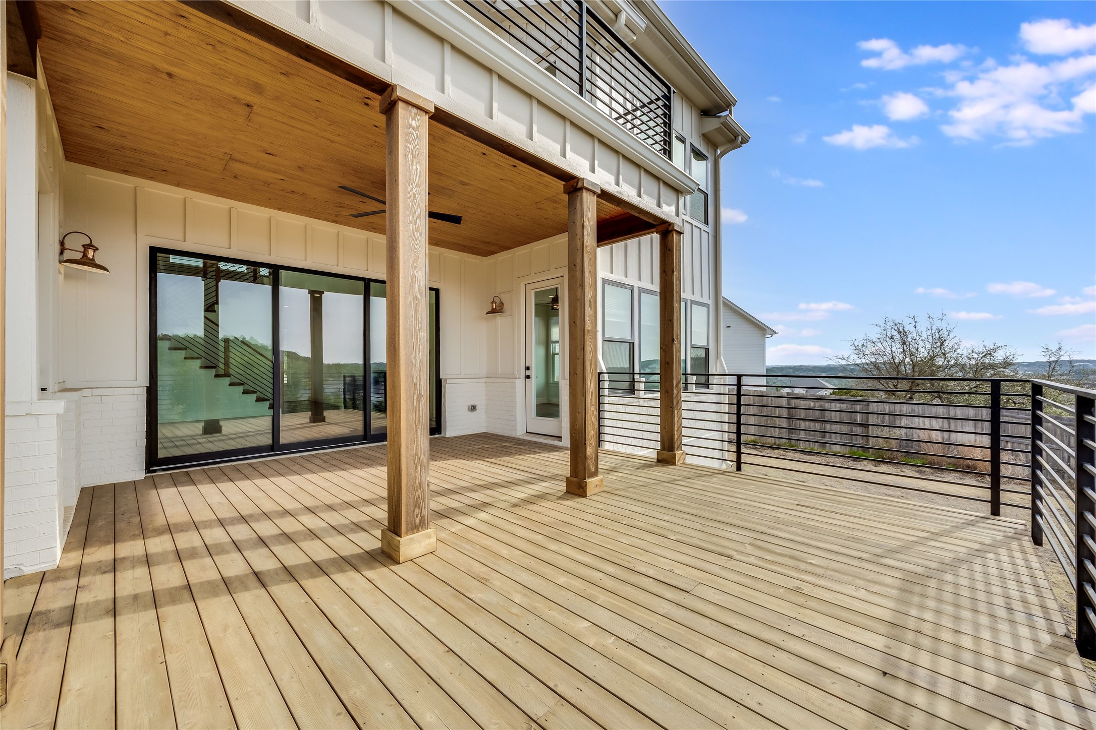 288 Smoke Tree Circle Dripping Springs, TX 78620 - Photo 34 of 40 a view of a balcony with wooden floor