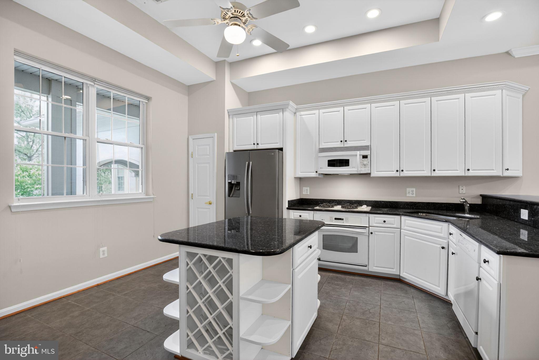 733 Runabout Loop, Unit 733 Solomons, MD 20688 - Photo 15 of 50 Island with wine racks