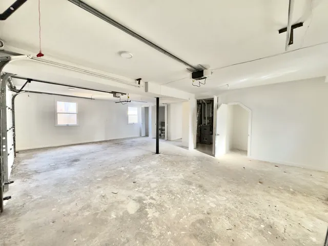 a view of a big room with closet and windows