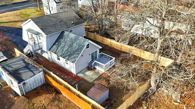 front view of a house with a small park
