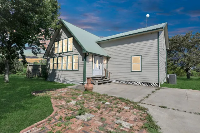 a backyard of a house with seating space