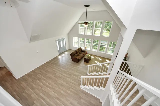 a view of an entryway with wooden floor