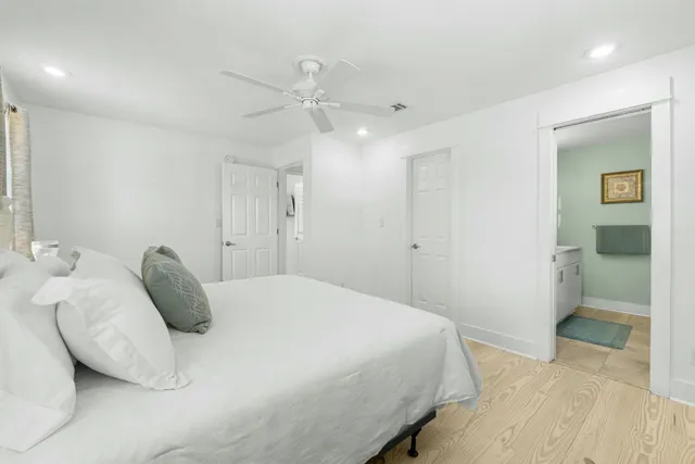 a bedroom with a bed and a walk in closet