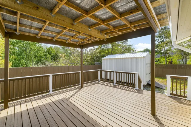a view of a wooden deck with a patio