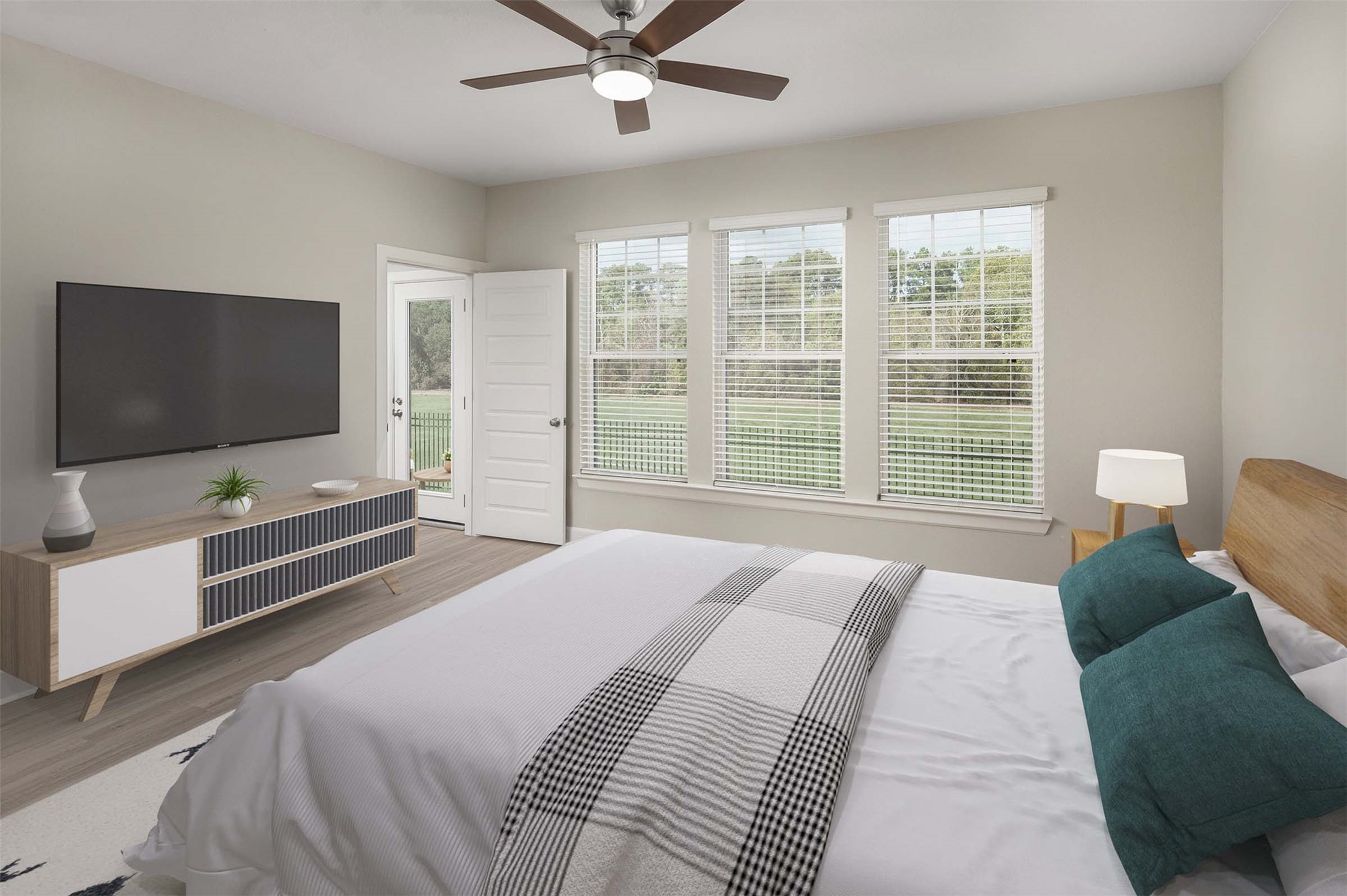 1840 Woodland Field Crossing, Unit 186 Spring, TX 77380 - Photo 10 of 15 a bedroom with a bed and a flat screen tv on dresser