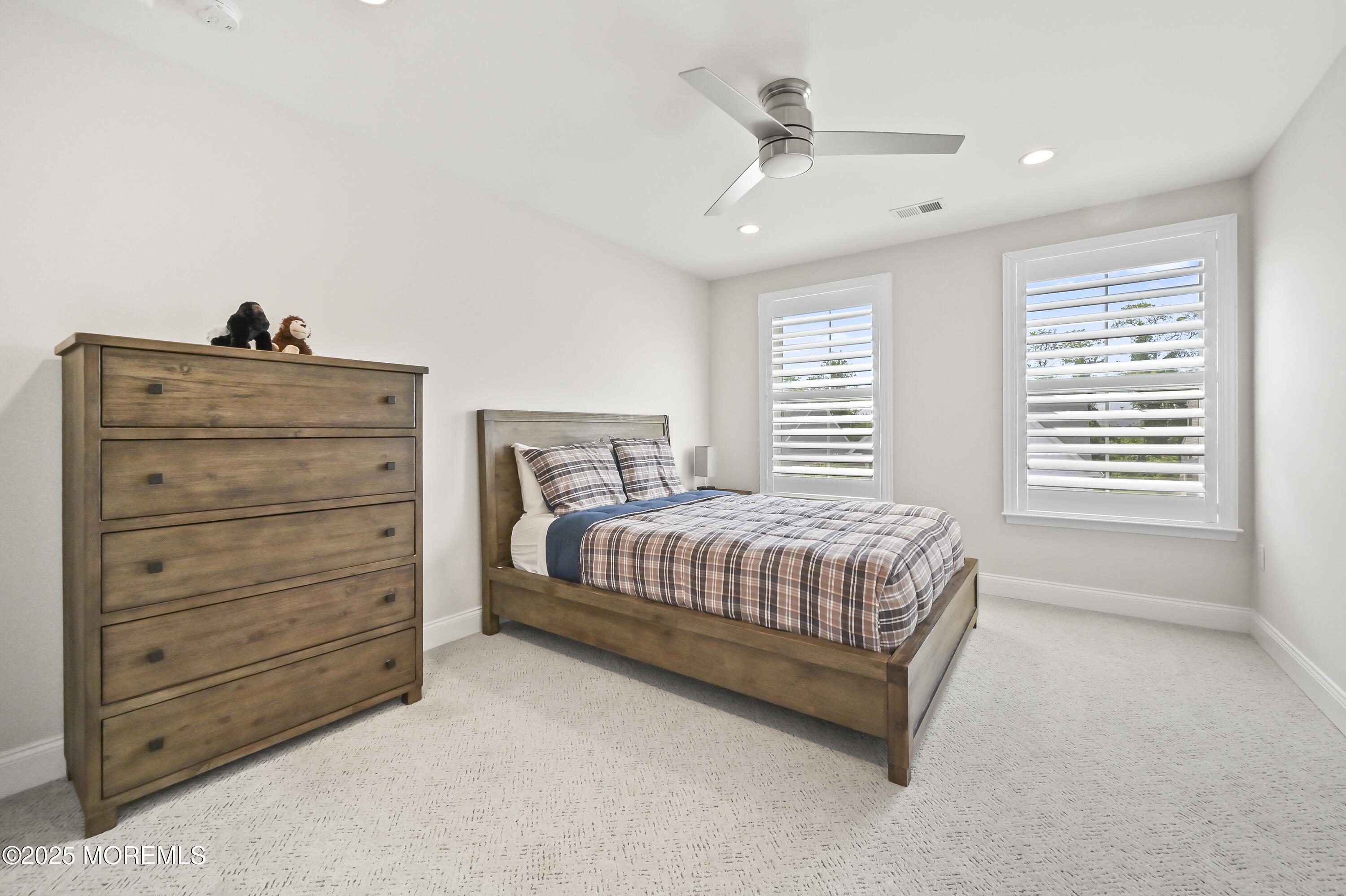 60 Sofia Drive Manalapan, NJ 07726 - Photo 16 of 25 a spacious bedroom with a bed a window and closet