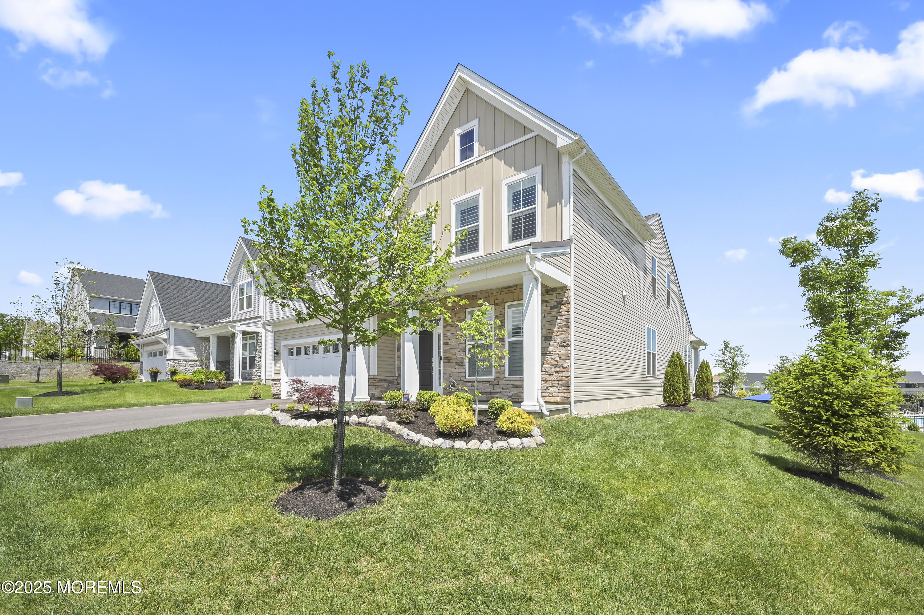 60 Sofia Drive Manalapan, NJ 07726 - Photo 2 of 25 a front view of a house with a yard