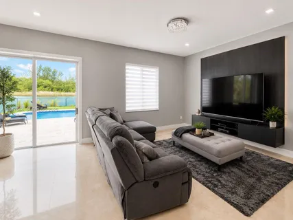 a living room with furniture and a flat screen tv