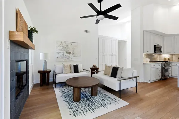 a view of a dining room with furniture and chandelier