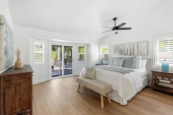 a bathroom with a sink mirror and a shower