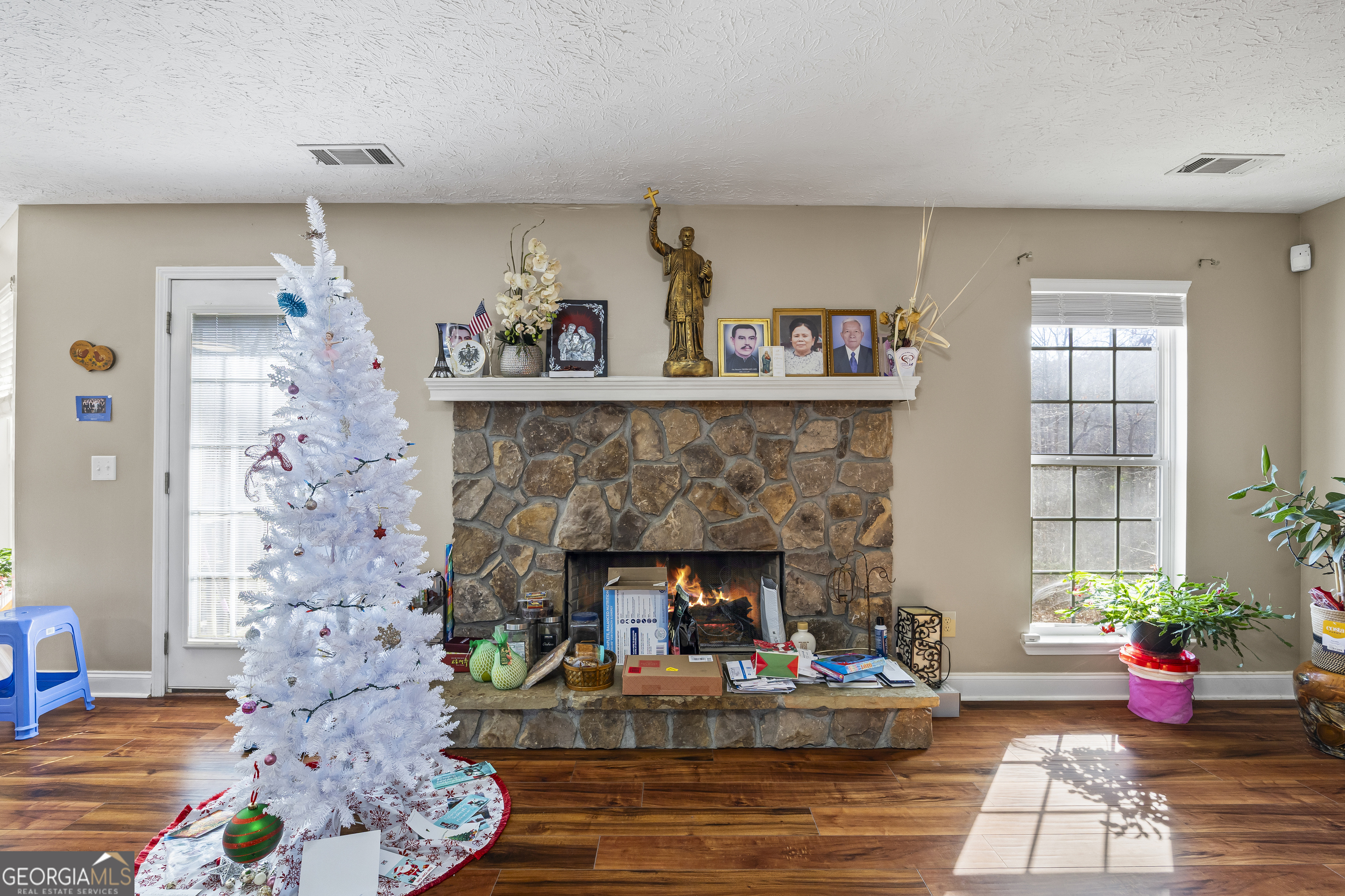 747 Washington Road Lexington, GA 30648 - Photo 109 of 118 a living room with furniture and a fireplace
